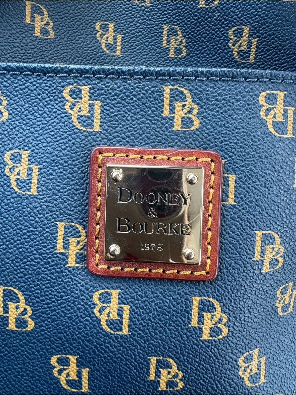 Dooney & Bourke navy with Brown Trim Monogram Crossbody